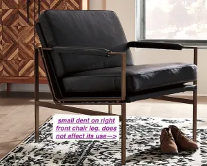 Full assembled Ashley Furniture Puckman Accent Chair, Black Leather! (Please Note: small dent on front right metal leg, does not affect its use) Retails $739  on sale